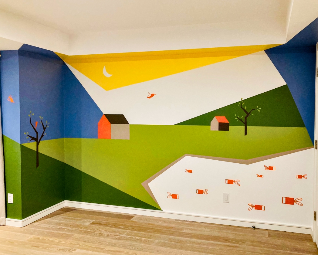 Minimalist cottage landscape mural in kids' room with green hills, orange houses, moon, and birds in geometric style