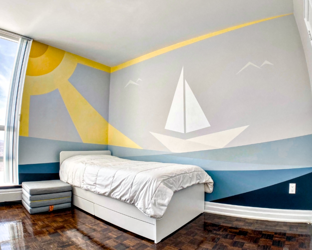 Minimalist sailboat and sunrise bedroom mural full room view with yellow sun rays wrapping corner wall and white sailboat on blue ocean